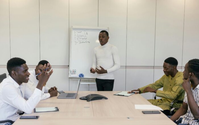 Employees sitting around a conference table