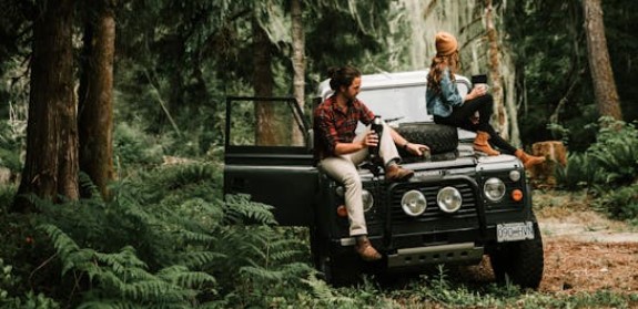 Couple sitting on a car together